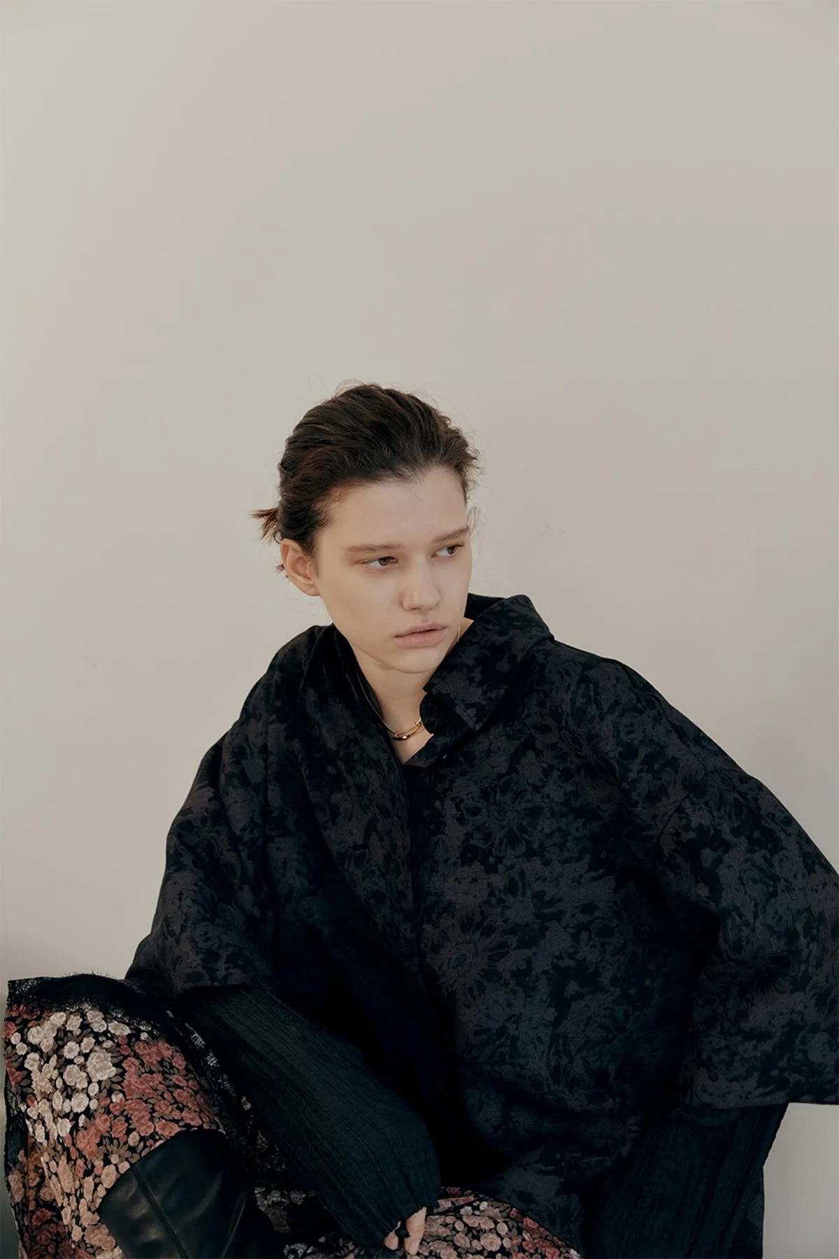 Oversized floral-print shirts layered with lace-trimmed skirt