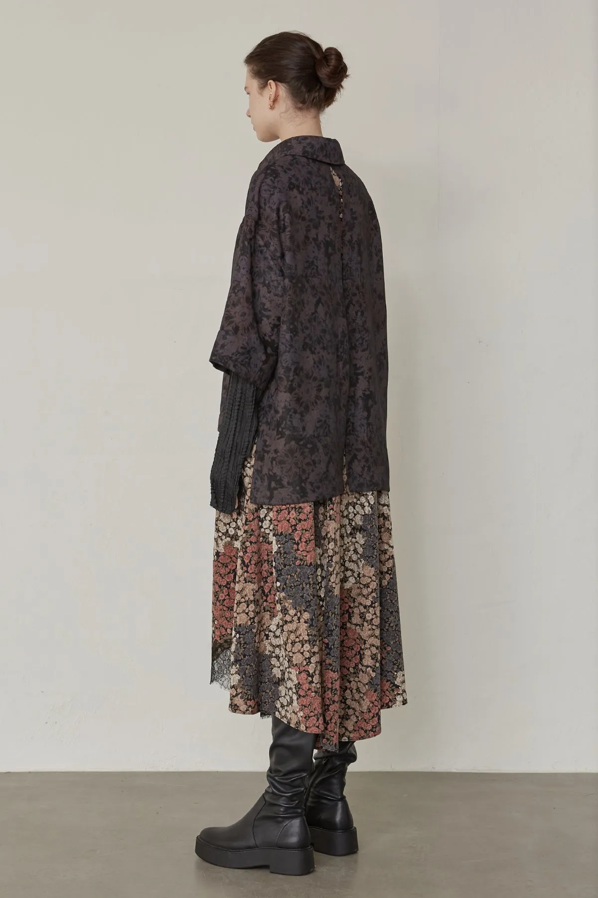 Oversized floral-print shirts layered with lace-trimmed skirt