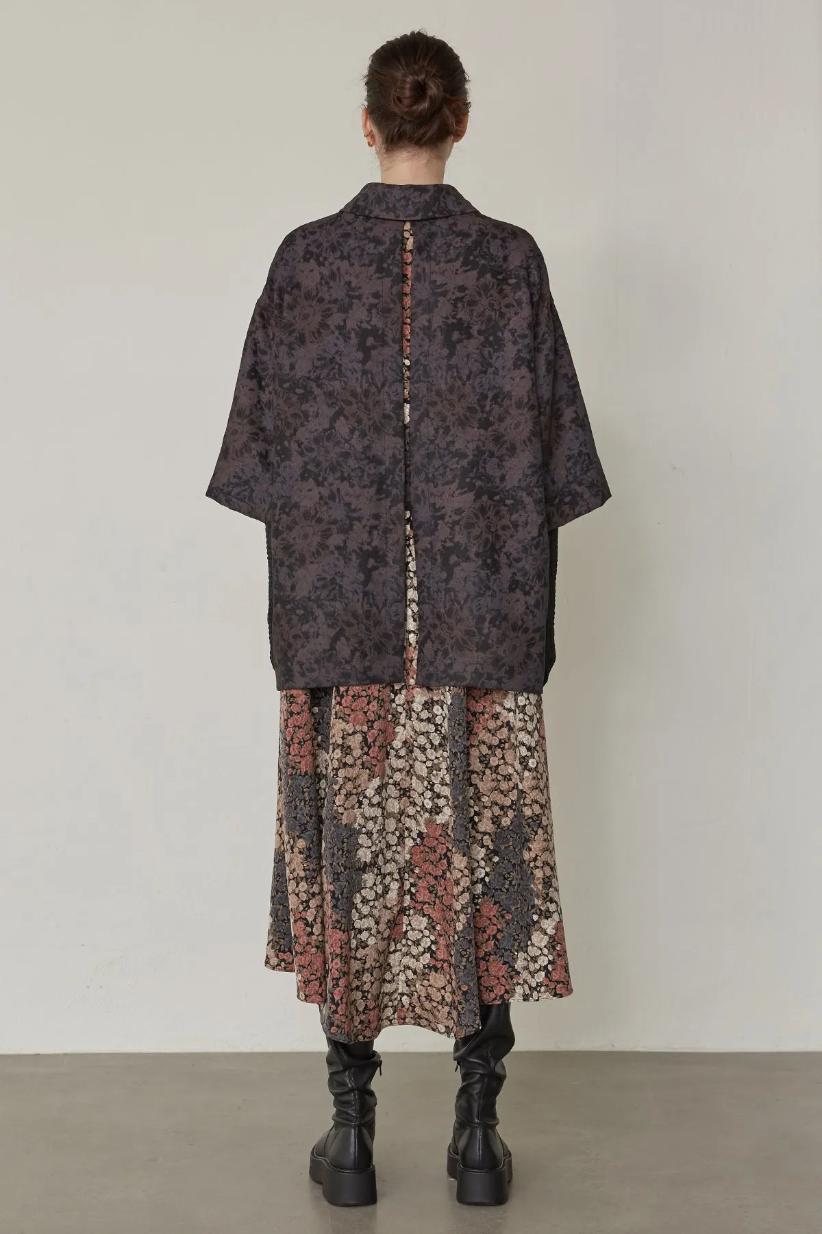 Oversized floral-print shirts layered with lace-trimmed skirt