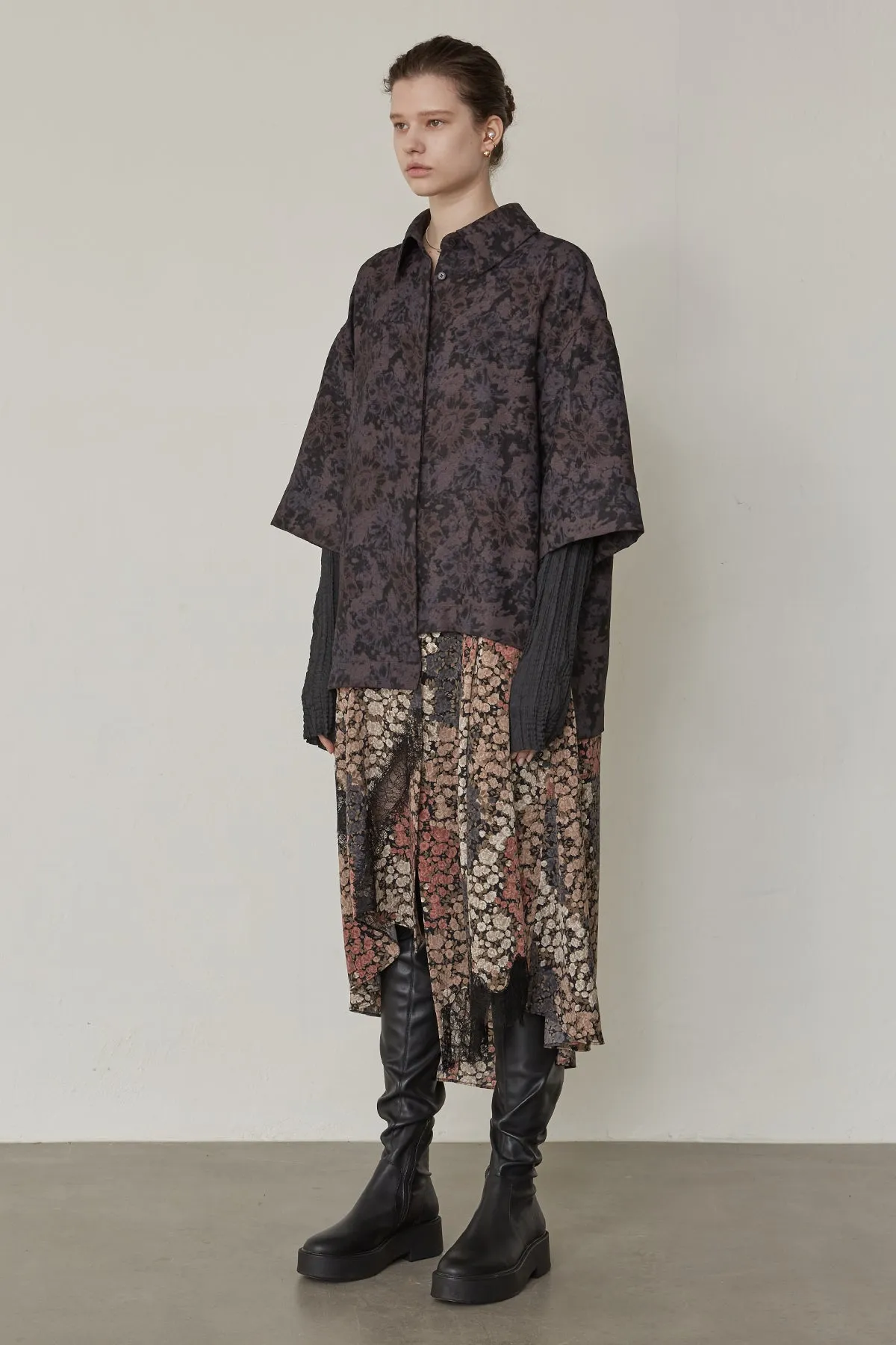 Oversized floral-print shirts layered with lace-trimmed skirt